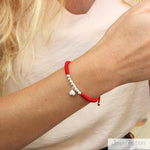 Pulsera de Hilo Rojo con 8 Esferas con Cascabel Ajustable