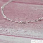 TOBILLERA DOBLE CADENAS Y ESFERAS
