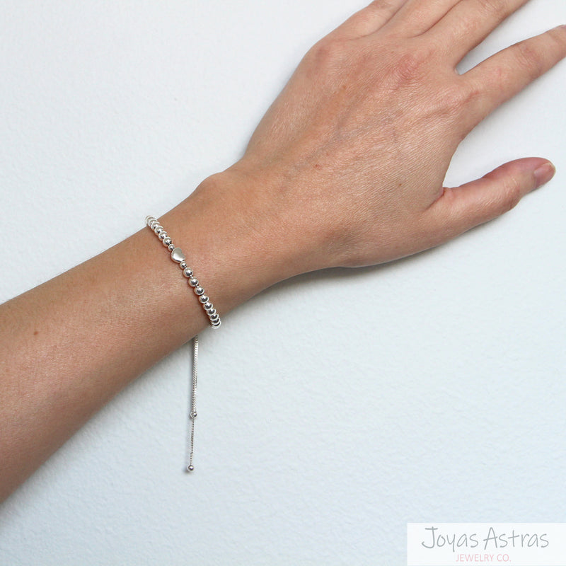PULSERA CON ESFERAS HEART AJUSTABLE