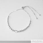 PULSERA CON ESFERAS HEART AJUSTABLE