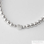 PULSERA CON ESFERAS HEART AJUSTABLE